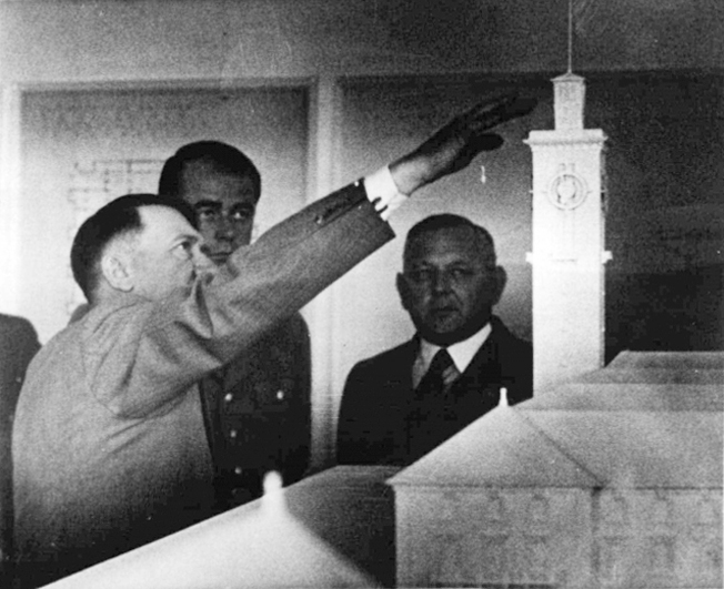 Adolf Hitler in Bayreuth's Sieberthalle inspects a model of a new building for the city